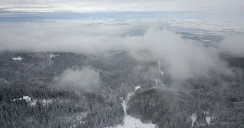 4K Drone view in cloudy and snowy mountains Stock Footage 125765887