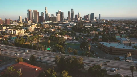 4K Drone View Of Echo Park Lake And Downtown Los Angeles Skyline At Sunset Stock Footage
