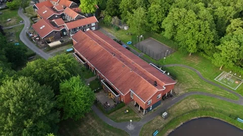 4K Drone View of Isolated Orange-Roofed House in Forest Netherlands Stock Footage 317400920