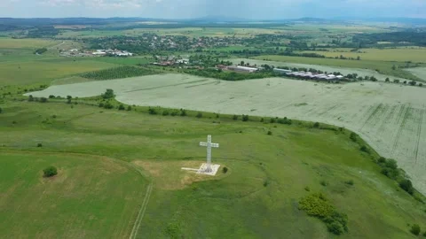 4K Drone view. A large sculptural structure of a Christian cross in the Balkans Stock Footage 243061494