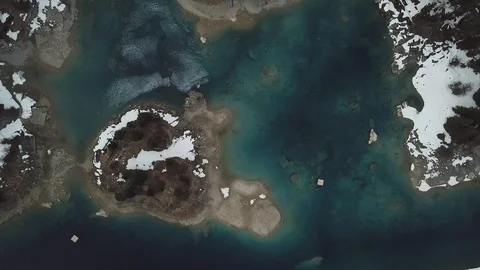 4K Drone View over Mountain lake in autumn, winter with snow and forest and way Stock-Footage 90776168