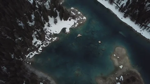 4K Drone View over Mountain lake in autumn, winter with snow and forest and way 스톡 동영상 90776406
