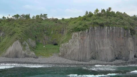 4K Drone View Pulling Away from Gaetkkak Columnar Jointing, Jeju Volcanic Island Stock Footage 143863112