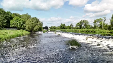 4K Drone View of River With Small Rapids and Green Banks Stockbeeldmateriaal 333336191