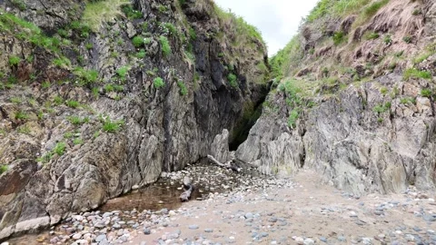 4K Drone View of Rocky Gorge With Green Hillsides Stock Footage 333336343