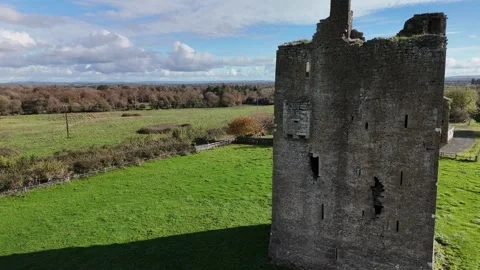 4K drone view of stone tower ruin in Ballagharahin Stock Footage 333707571