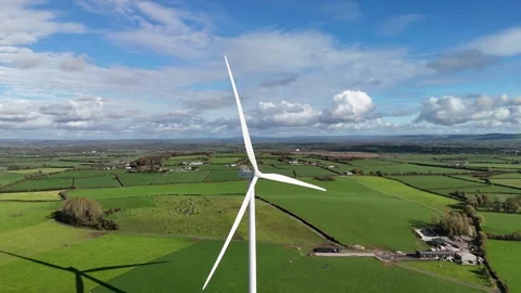 4K drone view of wind turbine over green farmland Stock-Footage 333707605