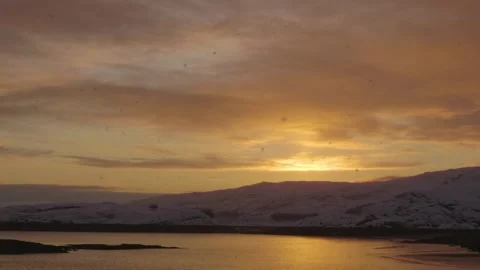 4K Drone View of Winter Sunset Over Lake Near Reykjavík, Iceland: Snowy Landscap Stock Footage 308925911