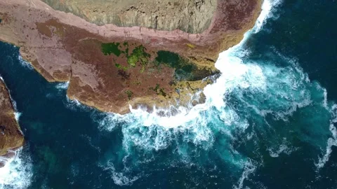 4K Drone Waves Crashing on Rugged Rock Coastline Stock Footage 331628873