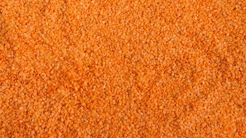 4K Dry red lentils falling onto a pile  from above, food for cooking with Stock Footage 90173490