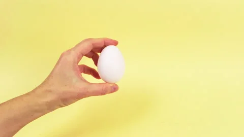 4k Easter creative concept. Yellow background.  Stop motion animation. Stock Footage 149945650