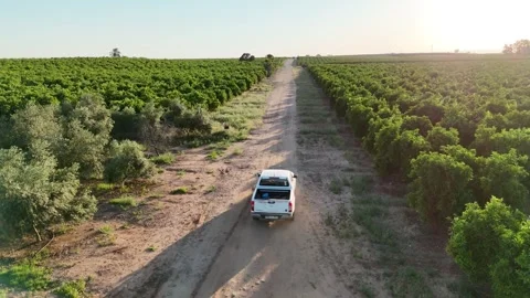 4K Editorial aerial view of a white car driving on a rural road in Spain Stock Footage 335956520