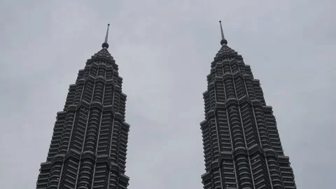 4K Editorial view of Petronas Twin Towers with a person silhouette 스톡 동영상 337086644