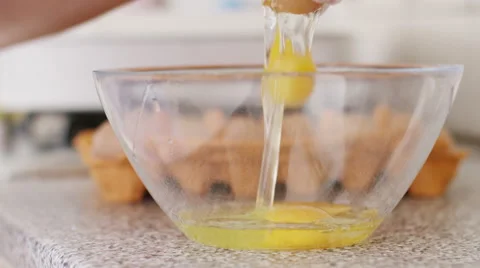 4K Egg being broken into a mixing bowl, in slow motion Stock Footage 56195880