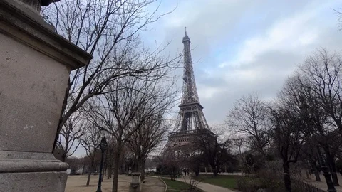 4K, Eiffel Tower in back of tree branches at winter day Paris, France. -Dan Stock Footage 106910684