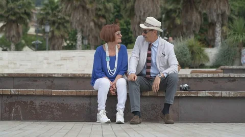 4K elderly couple having a cocktail on the beach Stock Footage 90802479
