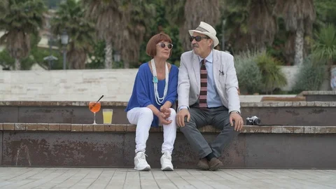 4K elderly couple having a cocktail on the beach Stock Footage 90802644