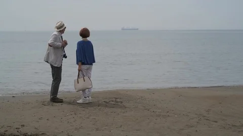4K elderly couple taking selfie on the beach Stock Footage 90803098
