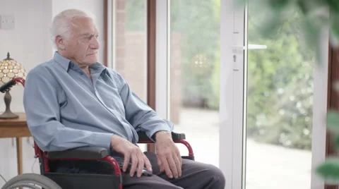 4K Elderly man in a wheelchair talking on mobile phone  Vidéo 56599345