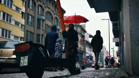 4k: Electric E scooters on pavement ready for ride in rainy Berlin, Germany Stock Footage 132176086