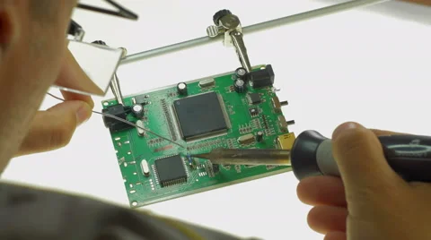 4K: Electronic Engineer Working, Soldering on Circuit Board Vídeo Stock 49741840