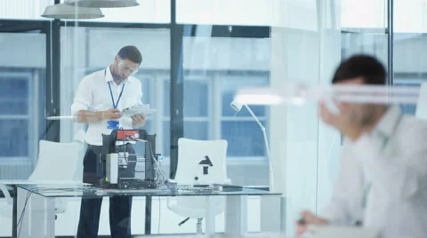 4K Electronic engineering team working in the lab, testing 3D printer &amp; circuit  Stock Footage 67885212