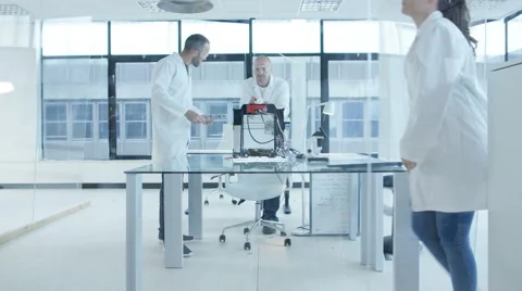 4K Electronics engineering team building &amp; testing robotics &amp; electronics Stock Footage 68026884