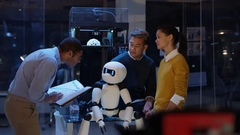 4K Electronics engineering team building robot with 3D printed components Stock Footage 73839365
