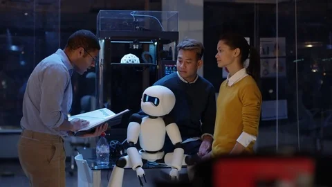 4K Electronics engineering team building robot with 3D printed components Stock Footage 73839602