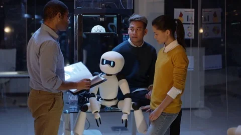 4K Electronics engineering team building robot with 3D printed components Stock Footage 73842047