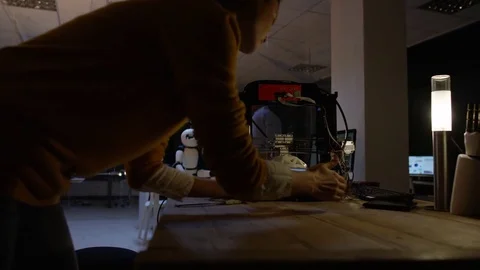 4K Electronics engineering team building robot with 3D printed components Stock Footage 73845806