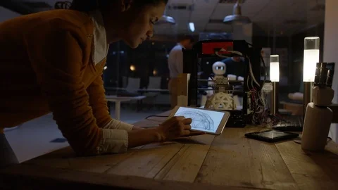 4K Electronics engineering team building robot with 3D printed components Stock Footage 73847286