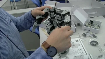 4K Electronics engineering team building &amp; testing robotics &amp; electronics Dec Stock Footage 85513488