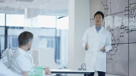4K Electronics engineering team discussing ideas in team meeting Stock Footage 67826964