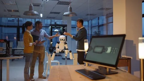 4K Electronics engineering team using 3D printed components to create a robot Stock Footage 73834434