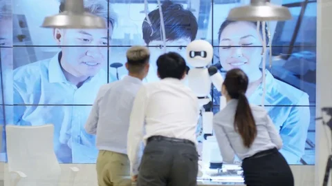 4K Electronics engineers testing design of robot with view of robot's image scan Stock Footage 71209675