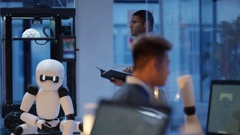 4K Electronics engineers using 3D printed components to create a robot Stock Footage 73828116
