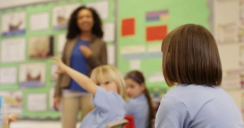 4K Elementary school teacher talking to her class & asking questions Stock Footage