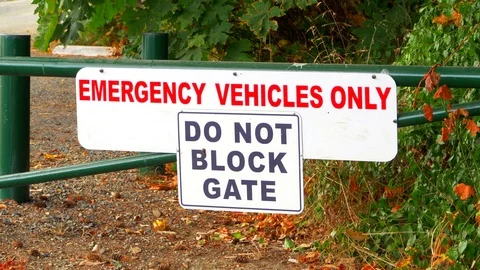 4K Emergency Vehicles Only Do Not Block Gate Sign, Metal Barrier Stock Footage 80105857