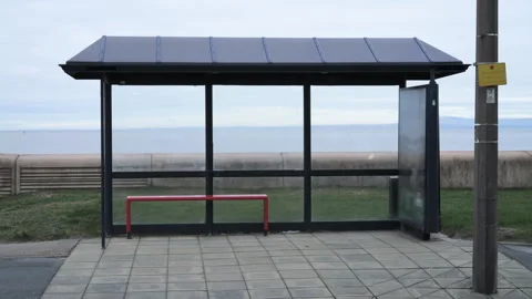 4K: Empty Bus Shelter or stop in the UK at a seaside town on an overcast Day. Stock Footage 326309041