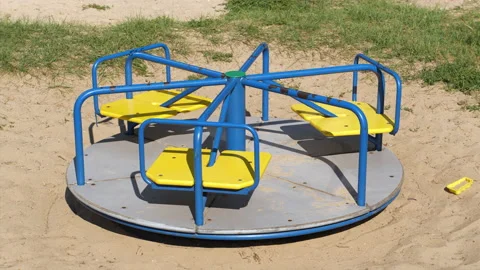 4K - Empty carousel spinning on the playground Stock Footage 139756364