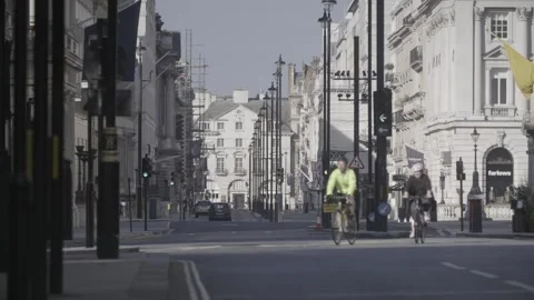 4K EMPTY CENTRAL LONDON STREETS LOCKDOWN / THE MALL / CYCLISTS / SUNNY / BLUE SK Stock Footage 286217340