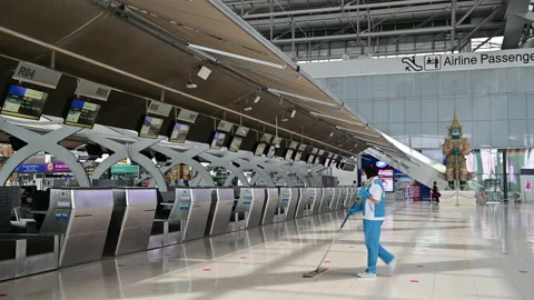 4K Empty check-in counters at the airport terminal due to pandemic of covid-19 Stock Footage 133396448