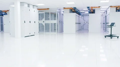 4K Empty interior of large modern data centre with rows of server racks Stock Footage 74876608
