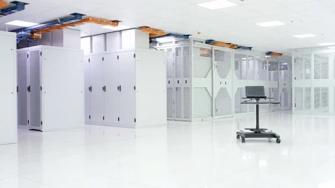4K Empty interior of large modern data centre with rows of server racks Stock Footage 74879575
