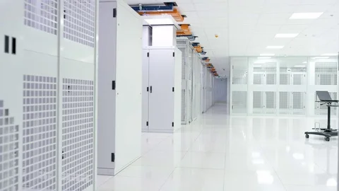 4K Empty interior of large modern data centre with rows of server racks Stock Footage 75023768