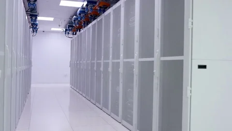 4K Empty interior of large modern data centre with rows of server racks Stock Footage 75024055