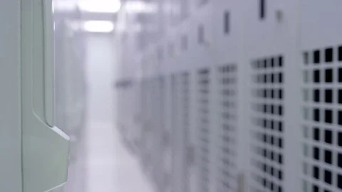 4K Empty interior of large modern data centre with rows of server racks Stock Footage 75025378