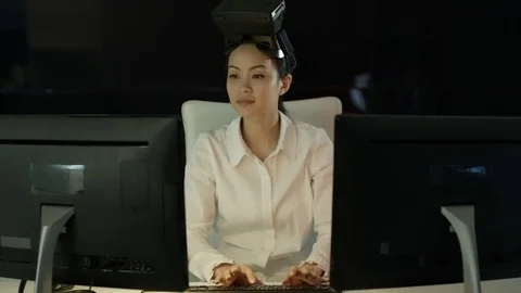 4K Engineer wearing VR viewer at desk with animated graphic in background Video stock 75966049