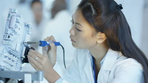 4K Engineer working in electronics factory building &amp; testing electronic devices Stock Footage 67757039